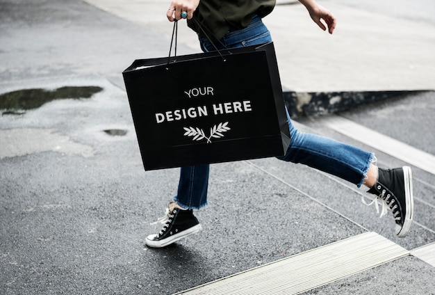 PSD woman carrying a shopping bag