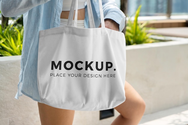 Woman carrying a tote bag mockup