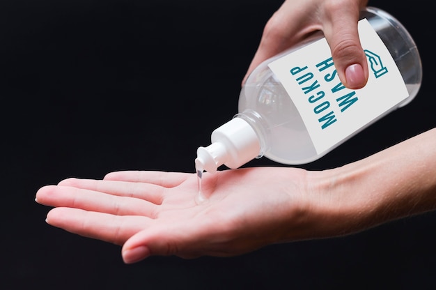 PSD woman disinfecting hands close-up