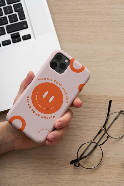 Woman hand holding smartphone mock-up indoors