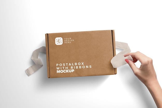 Woman hand opening postal box with ribbons  mockup