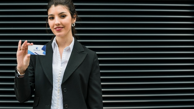 PSD woman holding business card copy-space