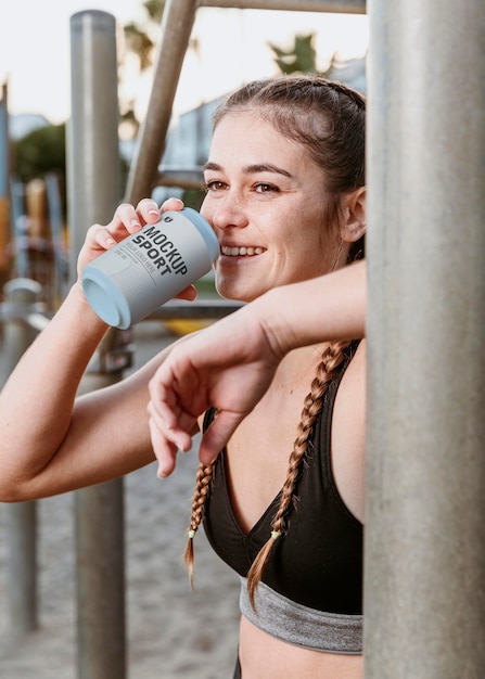 Woman holding can medium shot