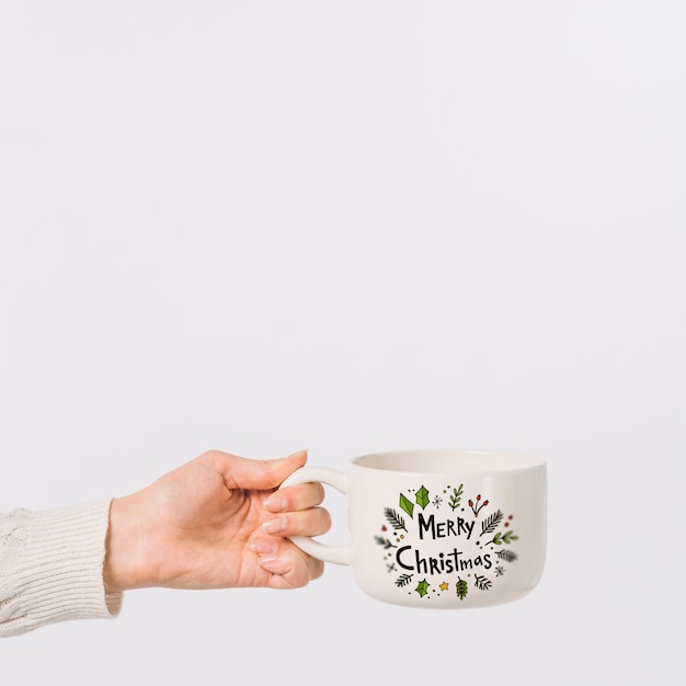 PSD woman holding cup mockup with christmas concept