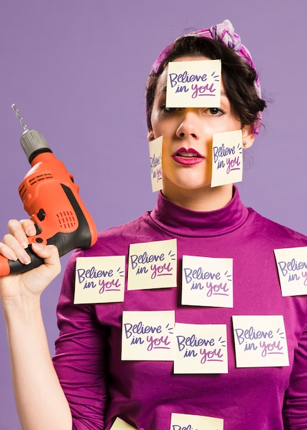 woman holding drilling machine