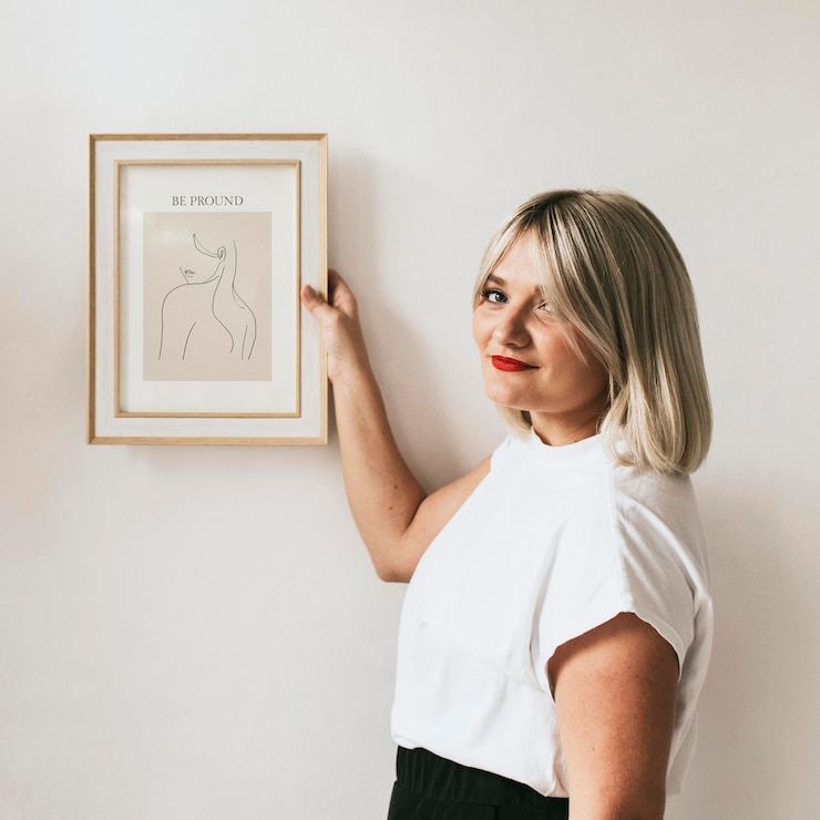 PSD woman holding frame mockup psd