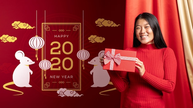 Woman holding gift box for new year