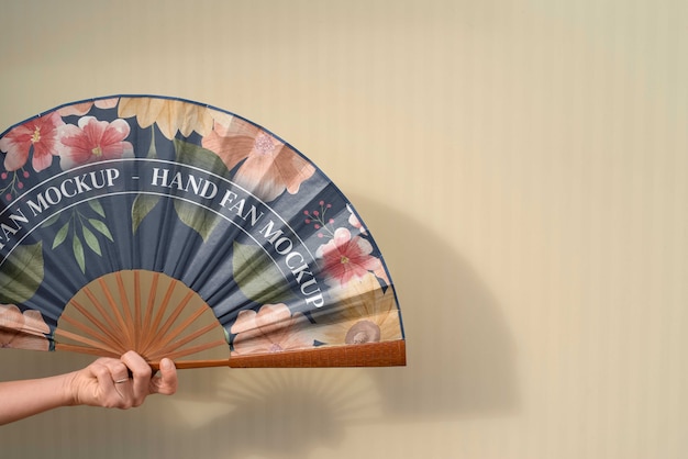 PSD woman holding hand fan with mock-up design