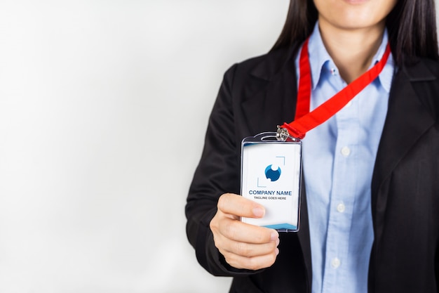 PSD woman holding id card mockup