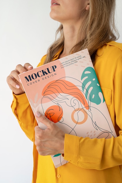 woman holding magazine side view