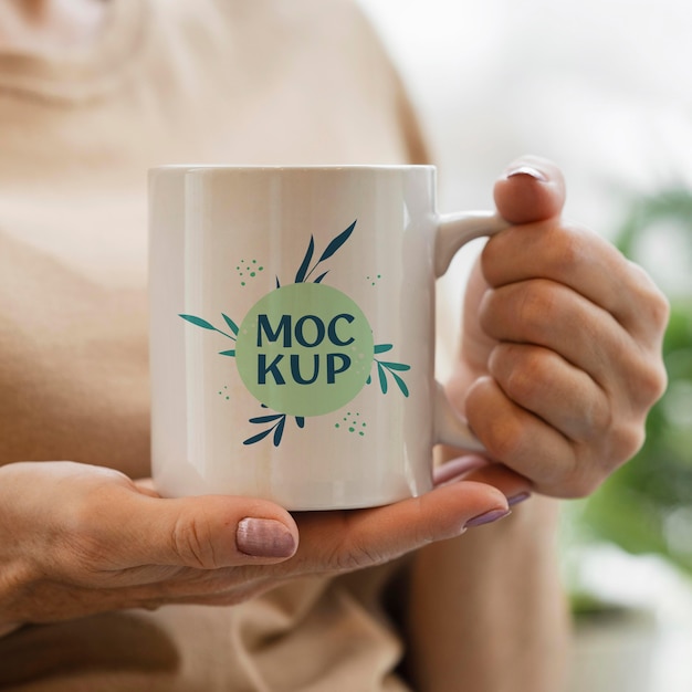 PSD woman holding a mock-up mug in her urban orchard