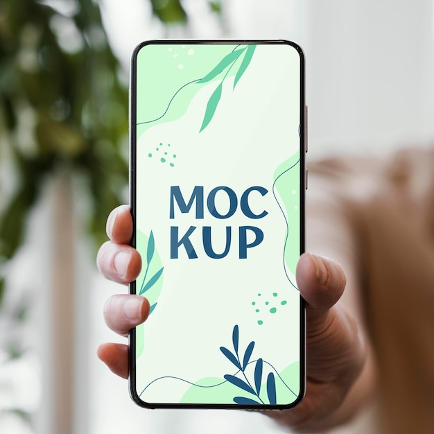 woman holding a mock-up smartphone in her urban orchard