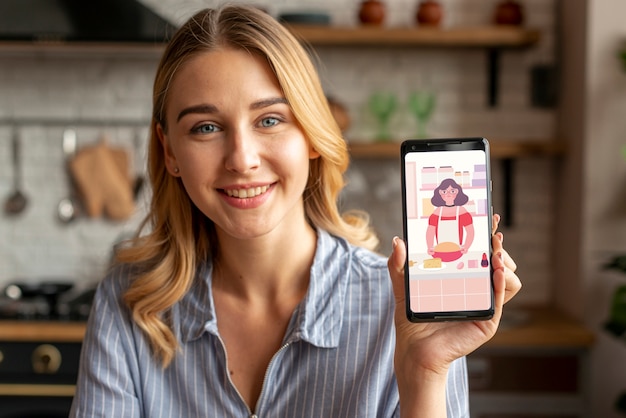 PSD woman holding a phone and smiling at camera