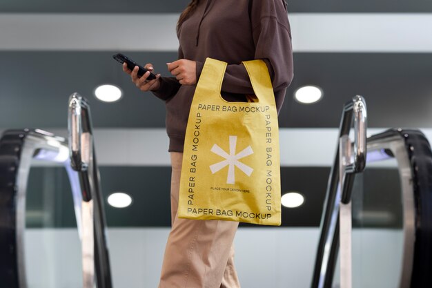 PSD woman holding shopping bag outdoors on the street