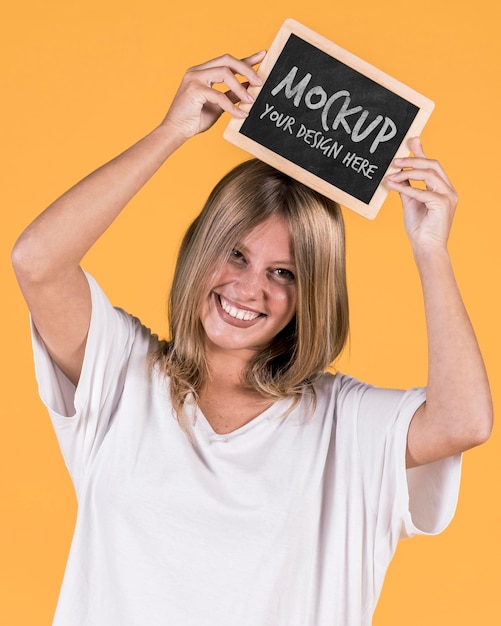 Woman holding sign mock-up