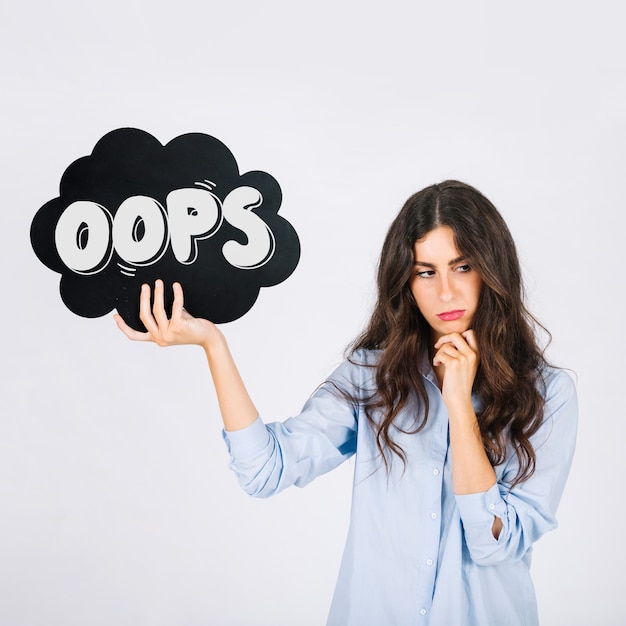 Woman holding speech bubble slate