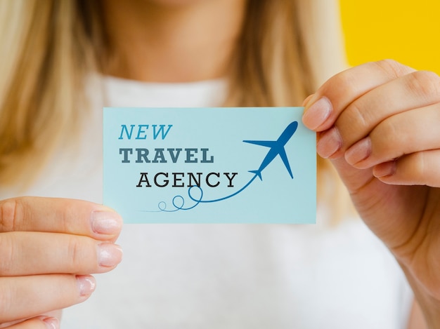 PSD woman holding a travel agency card