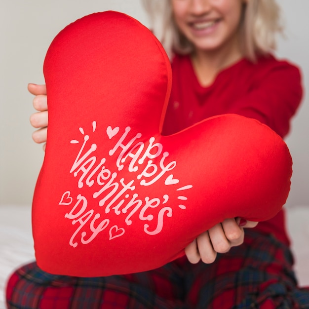 woman holding valentines day heart