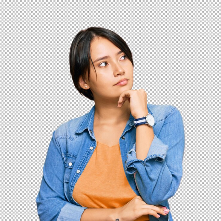 PSD woman in jeans jacket looking upwards and thinking