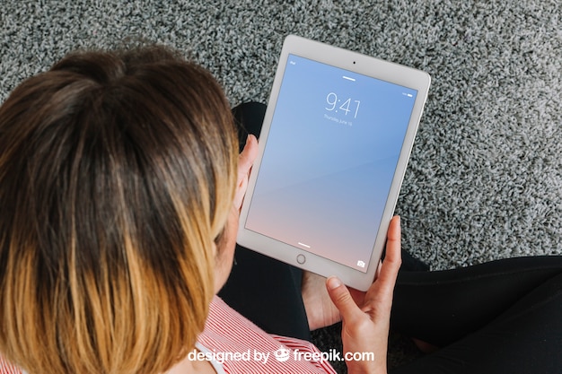 Woman looking at tablet