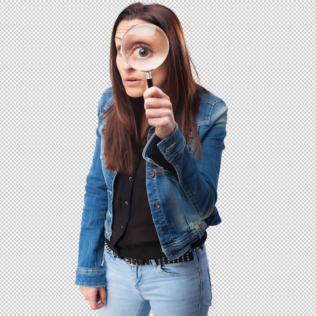 Woman looking through a magnifying glass