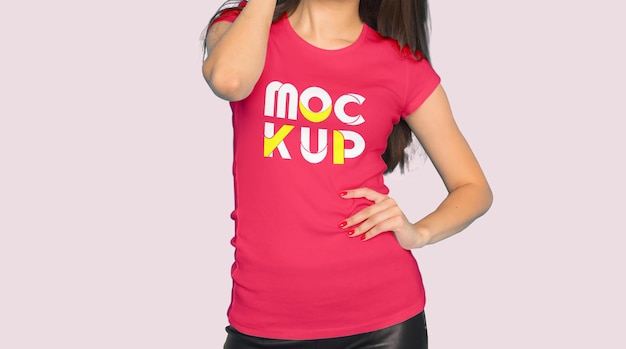 A woman in a pink shirt that says mockup.