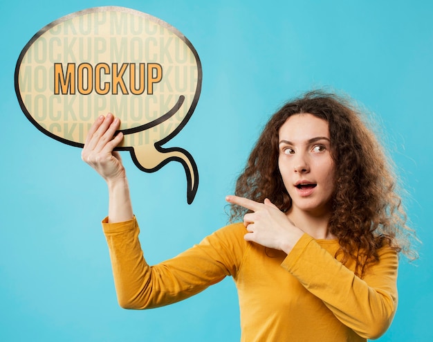 woman pointing at chat bubble