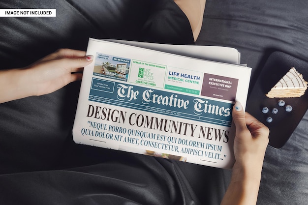 Woman relaxes and reads a newspaper mockup