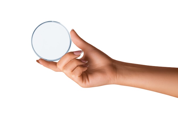 A woman's hand holds an empty petri dish on isolated transparent background