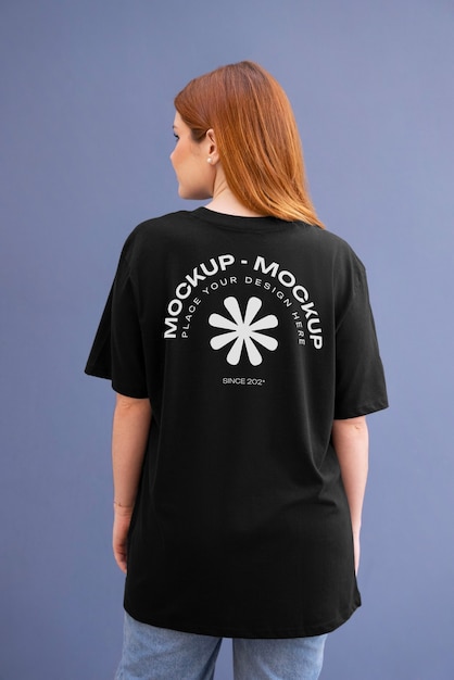 PSD woman showing back of t-shirt mock-up