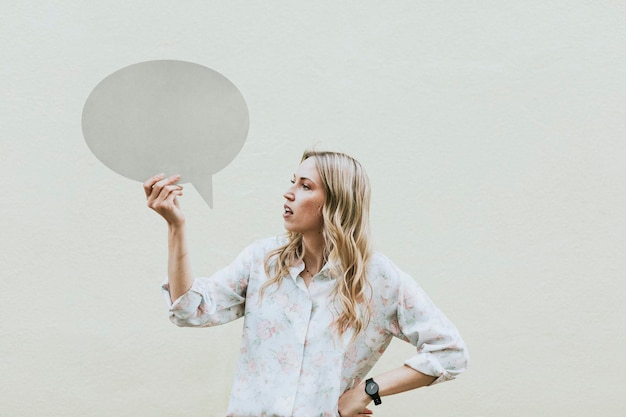 PSD woman showing a blank speech bubble