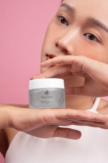 PSD woman showing face cream for skincare and beauty