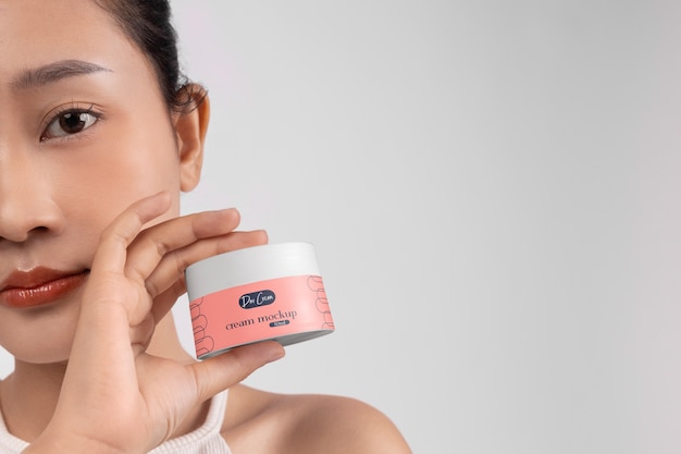 PSD woman showing face cream for skincare and beauty