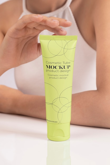 Woman showing face cream for skincare and beauty