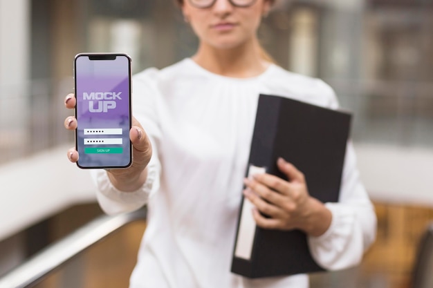 PSD woman showing her phone screen