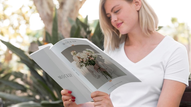 Woman on street reading book