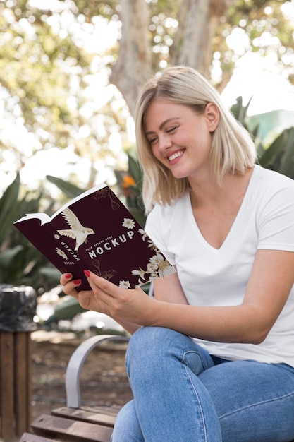 Woman on street reading book