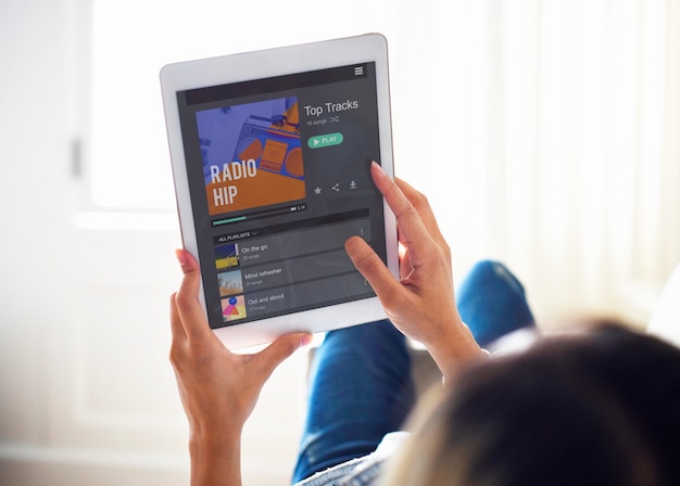 woman using a digital tablet and music radio concept