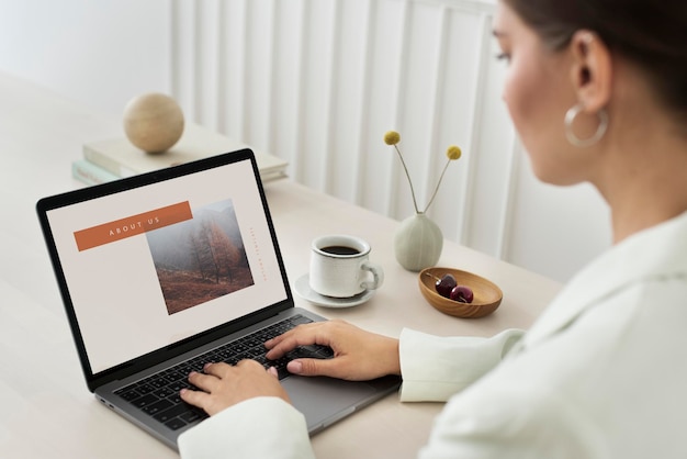 PSD woman using a laptop mockup