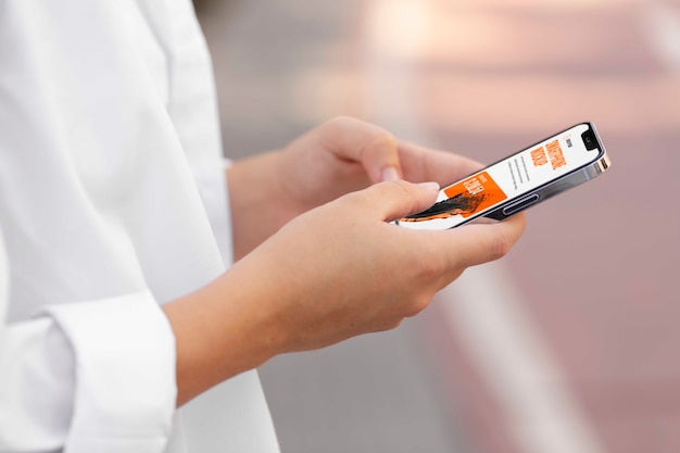 PSD woman using mock-up smartphone outdoors