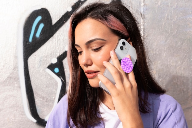 PSD woman using popsockets on phone