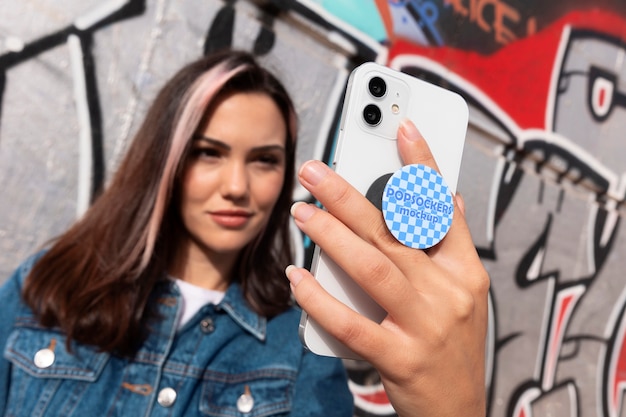 PSD woman using popsockets on phone