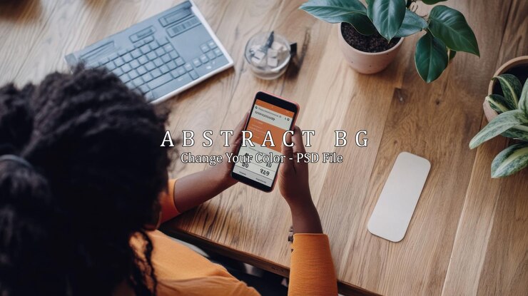 PSD woman using smartphone at wooden desk