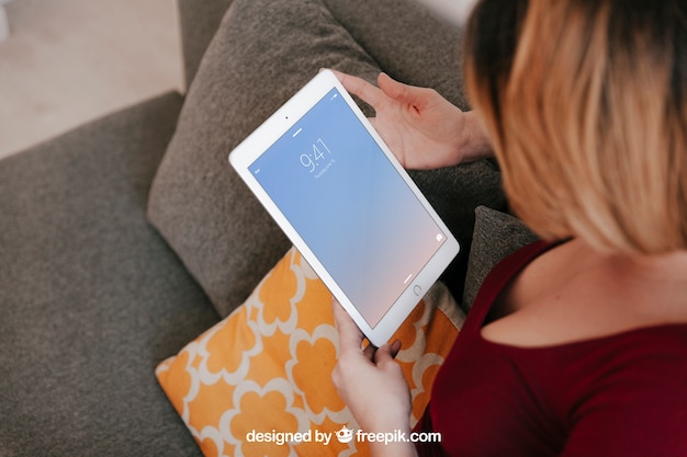 Woman using tablet at home