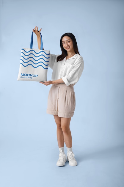 PSD woman wearing beach bag mockup