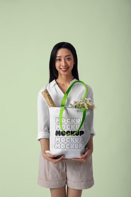 PSD woman wearing beach bag mockup