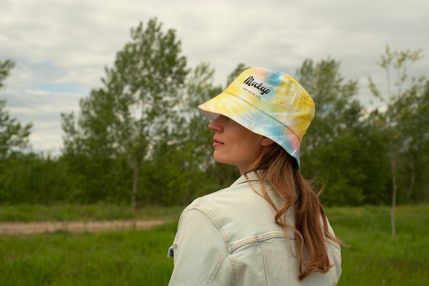 Woman wearing bucket hat mokcup