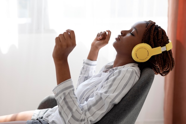 Woman wearing headphones medium shot