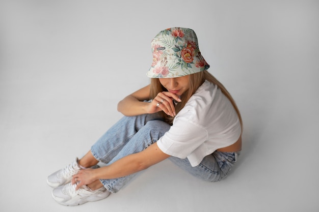 PSD woman wearing stylish bucket hat mock-up design