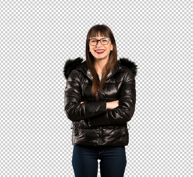 Woman with glasses keeping the arms crossed in frontal position